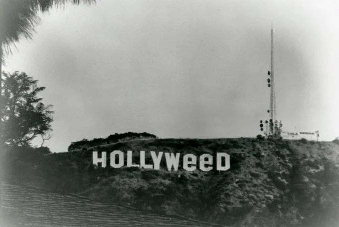 Hollywood Sign Parodies — Black and white photo of the Hollywood sign altered to read HOLLYWEED