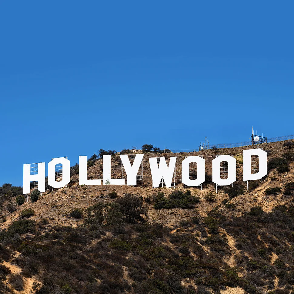Hollywood Sign Parodies — The Hollywood sign standing on a brown hillside against a clear blue sky
