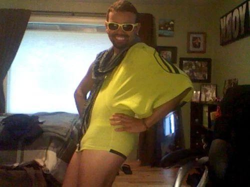 How To Make A Cute Dress Out Of Shorts — Person wears yellow shorts as dress with sunglasses for playful expression.