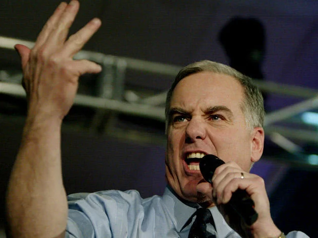 Howard Dean Scream — Close-up of Howard Dean yelling with raised hand and microphone
