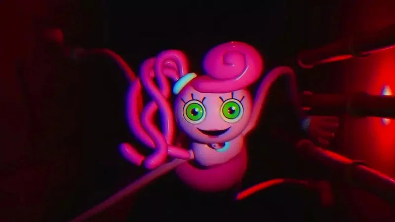 Huggy Wuggy (Poppy Playtime) — Mommy Long Legs, a pink doll-like character with green eyes and stretchy arms, from Poppy Playtime Chapter 2