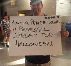 Hunter Pence Signs — Stadium photo of fan holding Kohl's poster board about wearing baseball jersey for Halloween.