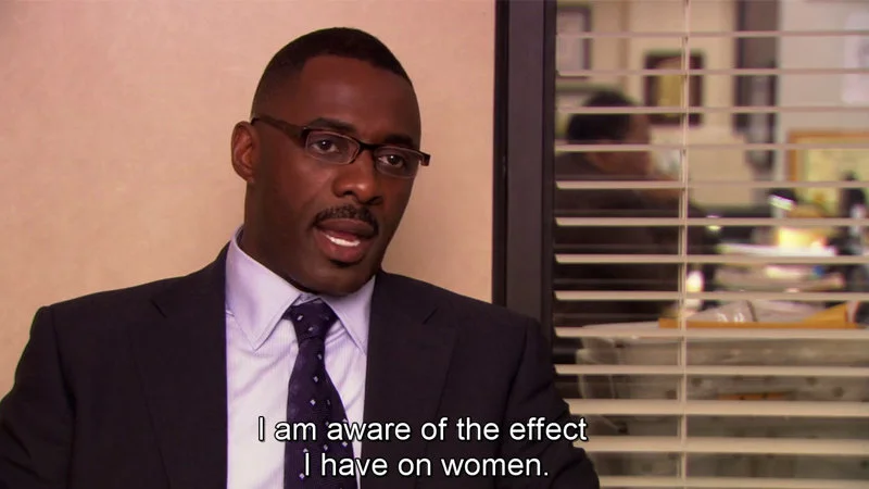 Clean Office screenshot of Charles Miner in confident seated pose with subtitle 'I am aware of the effect I have on women.'