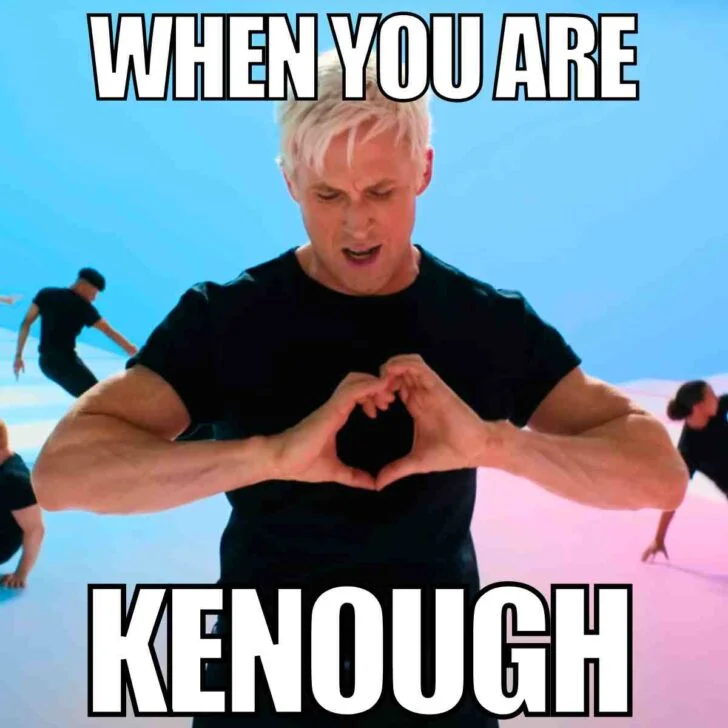 I Am Kenough — Ken character making heart shape with both hands against bright blue background with 'When You Are Kenough' text.