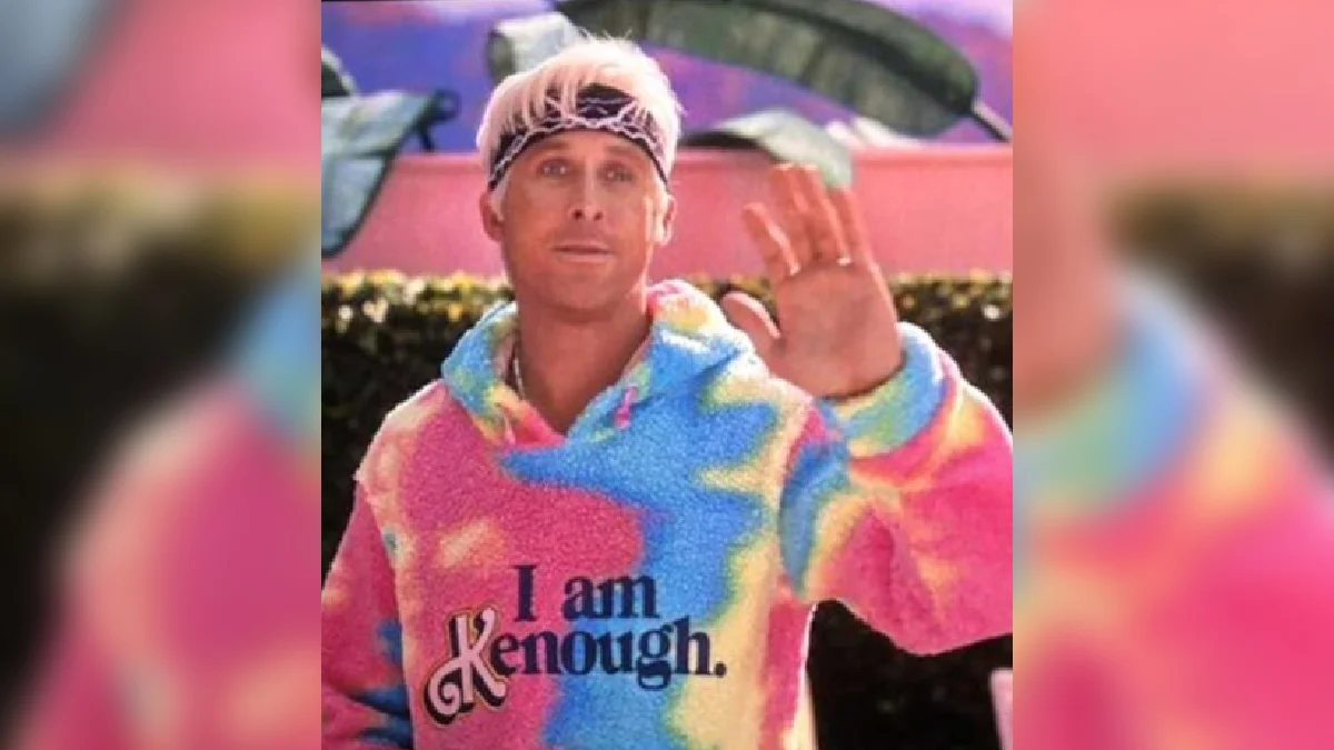 Ken character in iconic colorful tie-dye rainbow sweater with 'I am Kenough.' text and vignette effect.