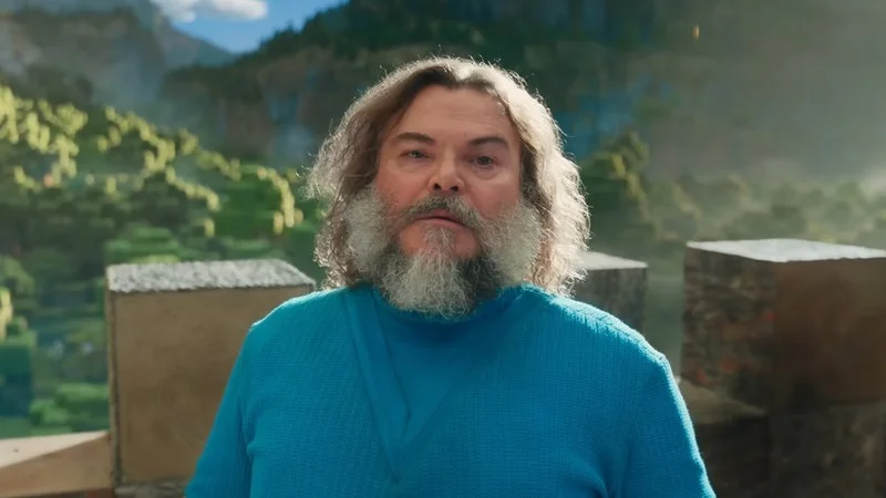 I Am Steve — Jack Black as Minecraft Steve with white beard and blue shirt against lush green Minecraft landscape.
