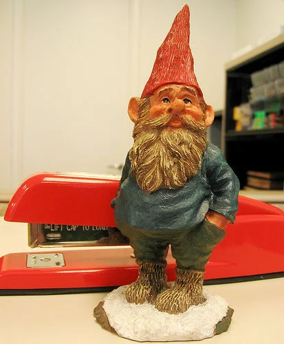 Red stapler illustration with text 'Excuse me, I believe you have my stapler..'
