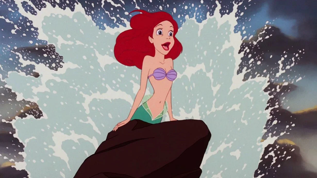 I Came — Ariel the mermaid emerging from a splashing wave on a rock