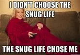 I Didnt Choose The Thug Life The Thug Life Chose Me — A woman sits on a couch wrapped in a red Snuggie holding a remote, with text 'I DIDN'T CHOOSE THE SNUG