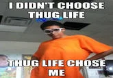 I Didnt Choose The Thug Life The Thug Life Chose Me — A young person in an orange shirt poses for a selfie against a plain background, with text 'I DIDN'T