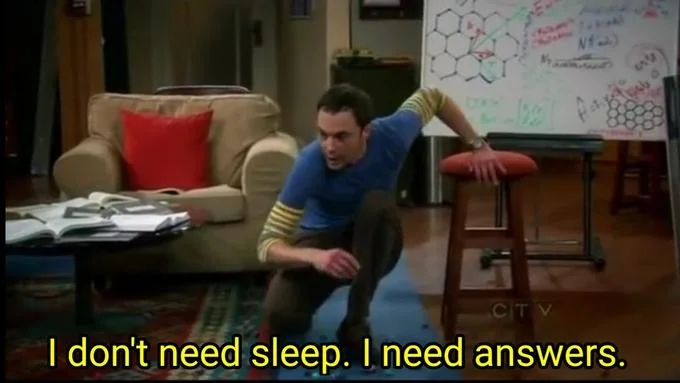 I Dont Need Sleep I Need Answers — Sheldon Cooper in characteristic research-focused pose surrounded by papers and notes with the meme quote visible.