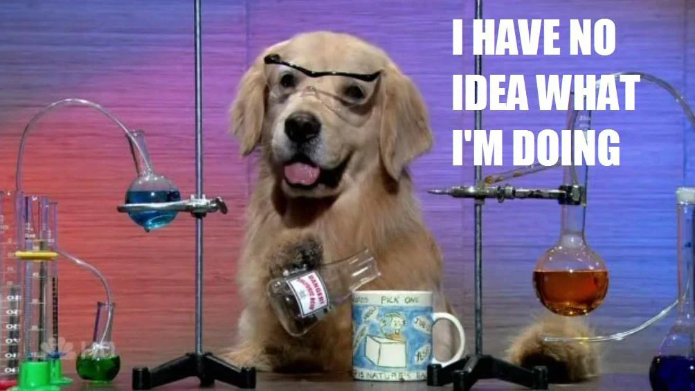 Golden retriever dressed as a scientist in a lab with 'I have no idea what I'm doing' caption