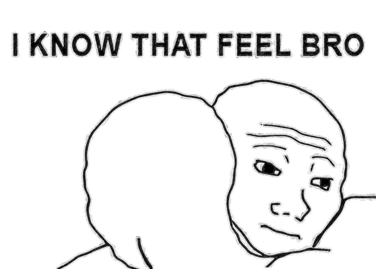 I Know That Feel Bro — Two Wojak characters in a supportive embrace against a clean white background expressing shared emotional understanding.