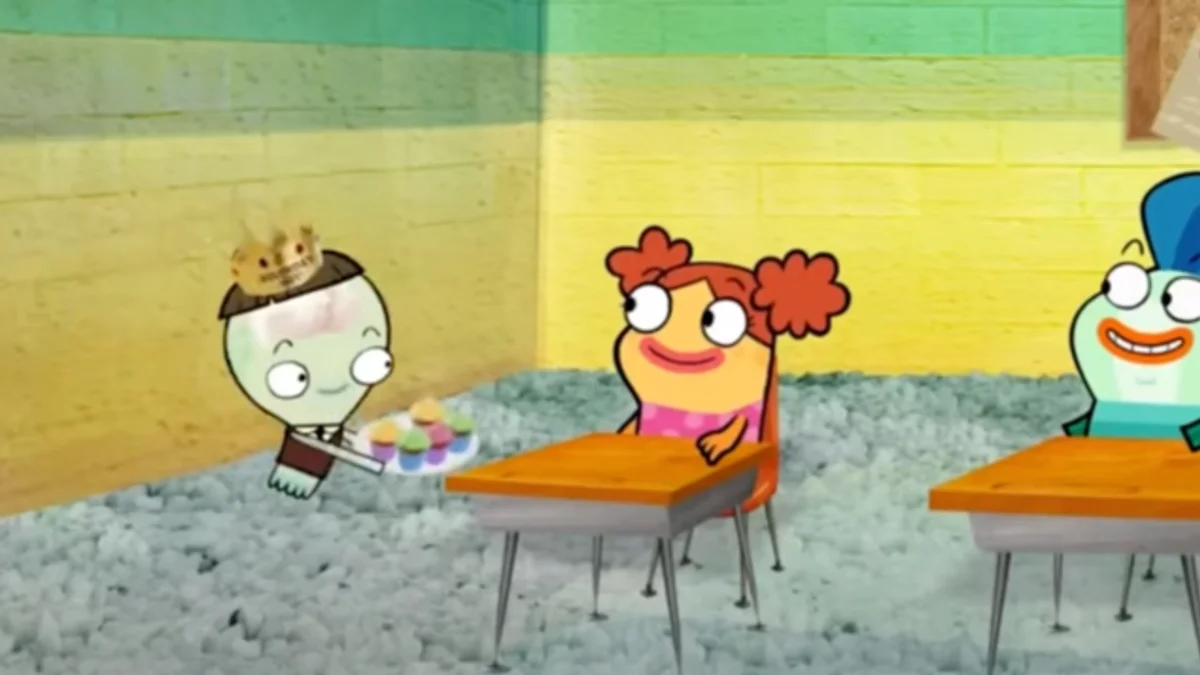 I Like You Have A Cupcake — Cartoon character with paper crown offering cupcakes to a red-haired girl at a school desk in Fish Hooks