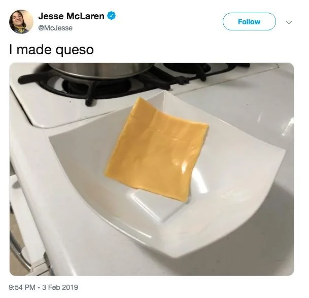 Tweet captioned 'I made queso' showing a single American cheese slice on a plate.