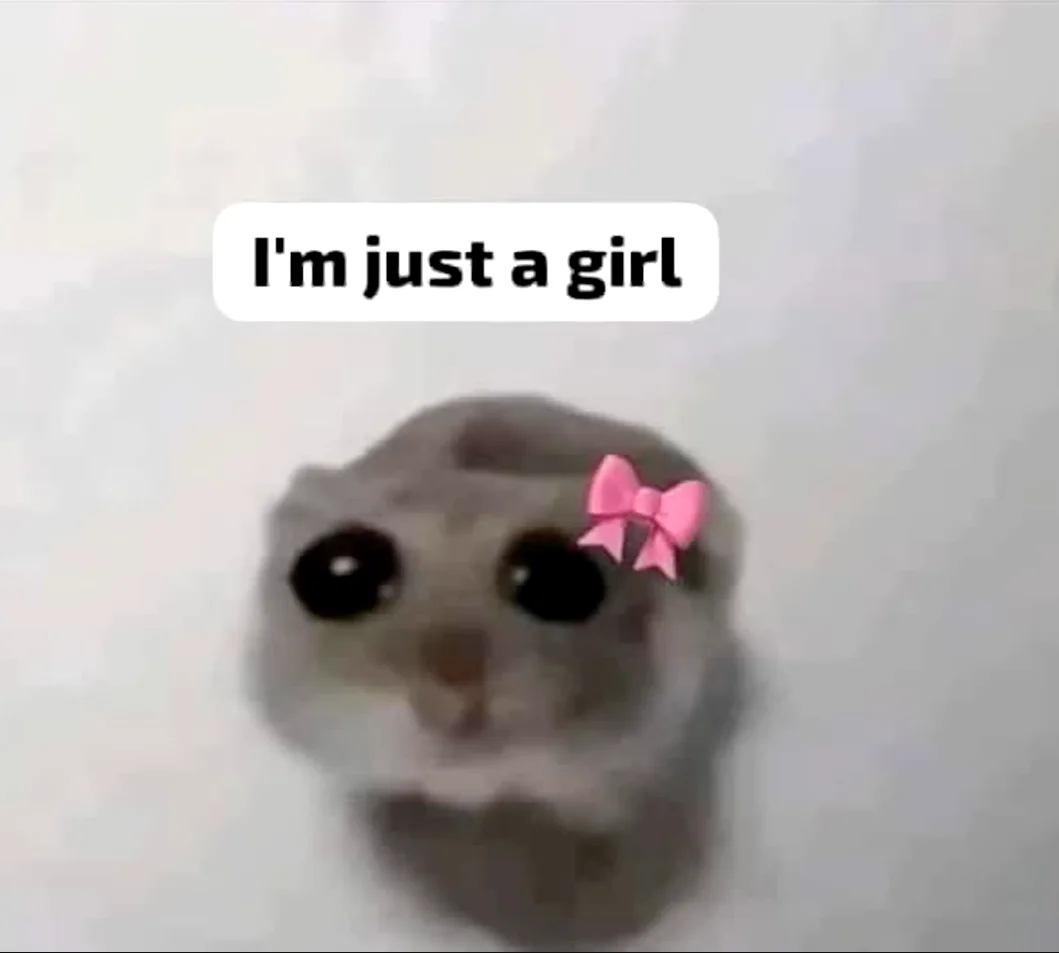 A wide-eyed creature with a pink bow displaying the phrase 'I'm just a girl' in a simple speech bubble.