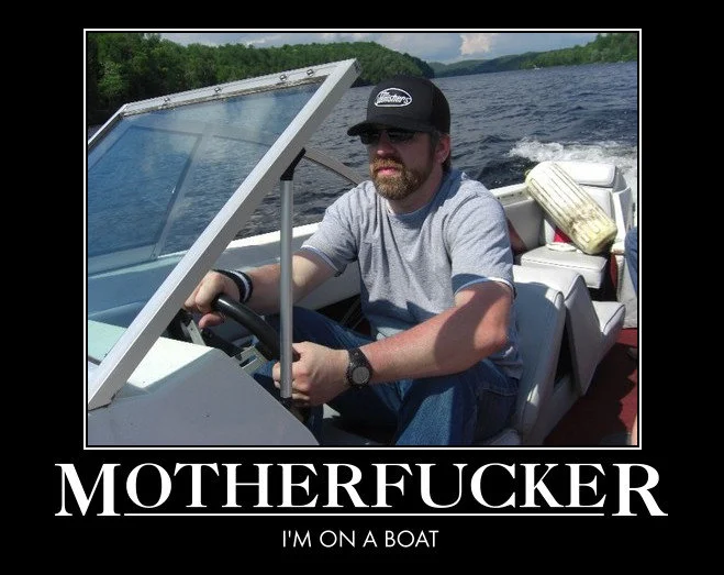 Demotivational poster of a man driving a speedboat captioned 'Motherfucker I'm on a boat'