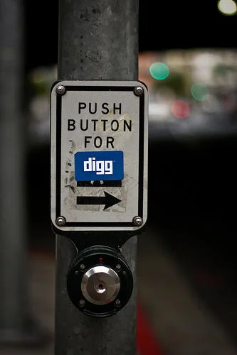 Internet Is Leaking — Street pedestrian button retrofitted with 'PUSH BUTTON FOR digg' label featuring Digg logo.