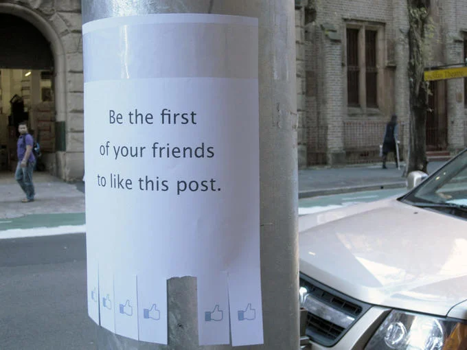 Internet Is Leaking — Cylindrical pole wrap featuring Facebook-style like button graphics and post message.