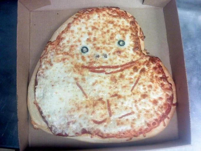 Internet Is Leaking — Baked pizza with cheerful smiley face created using cheese and sauce in pizza box.