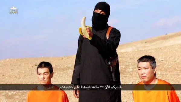 Isis Crappy Collage Grand Prix — Crappy collage from trend showing original still with crudely photoshopped banana added to militant's hand.