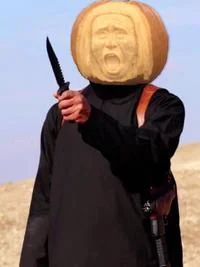Isis Crappy Collage Grand Prix — Crappy collage showing original still with crudely photoshopped jack-o'-lantern pumpkin replacing hostage's head.
