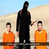Isis Crappy Collage Grand Prix — Clean screenshot of original ISIL hostage video with two Japanese hostages in orange and masked militant against desert