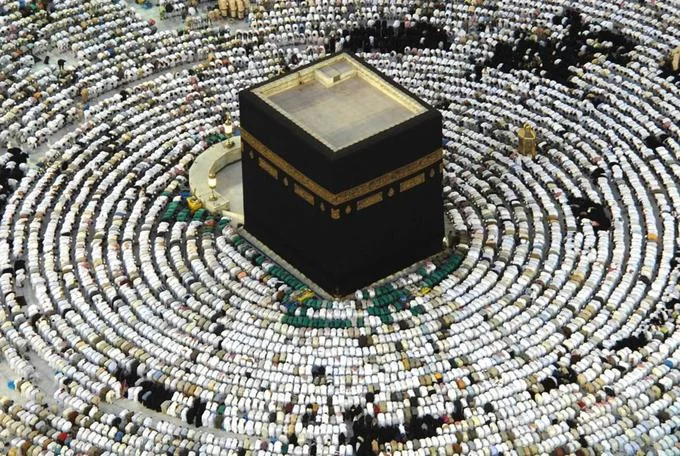 Islam — Aerial view of the Kaaba surrounded by circles of praying pilgrims in Mecca