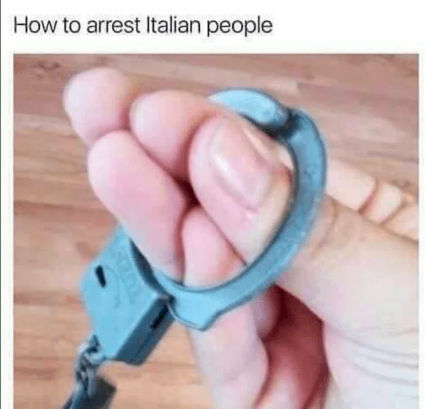Italian hand — Photograph of hand making pinched-finger Italian gesture while wearing blue handcuff with arrest joke text.