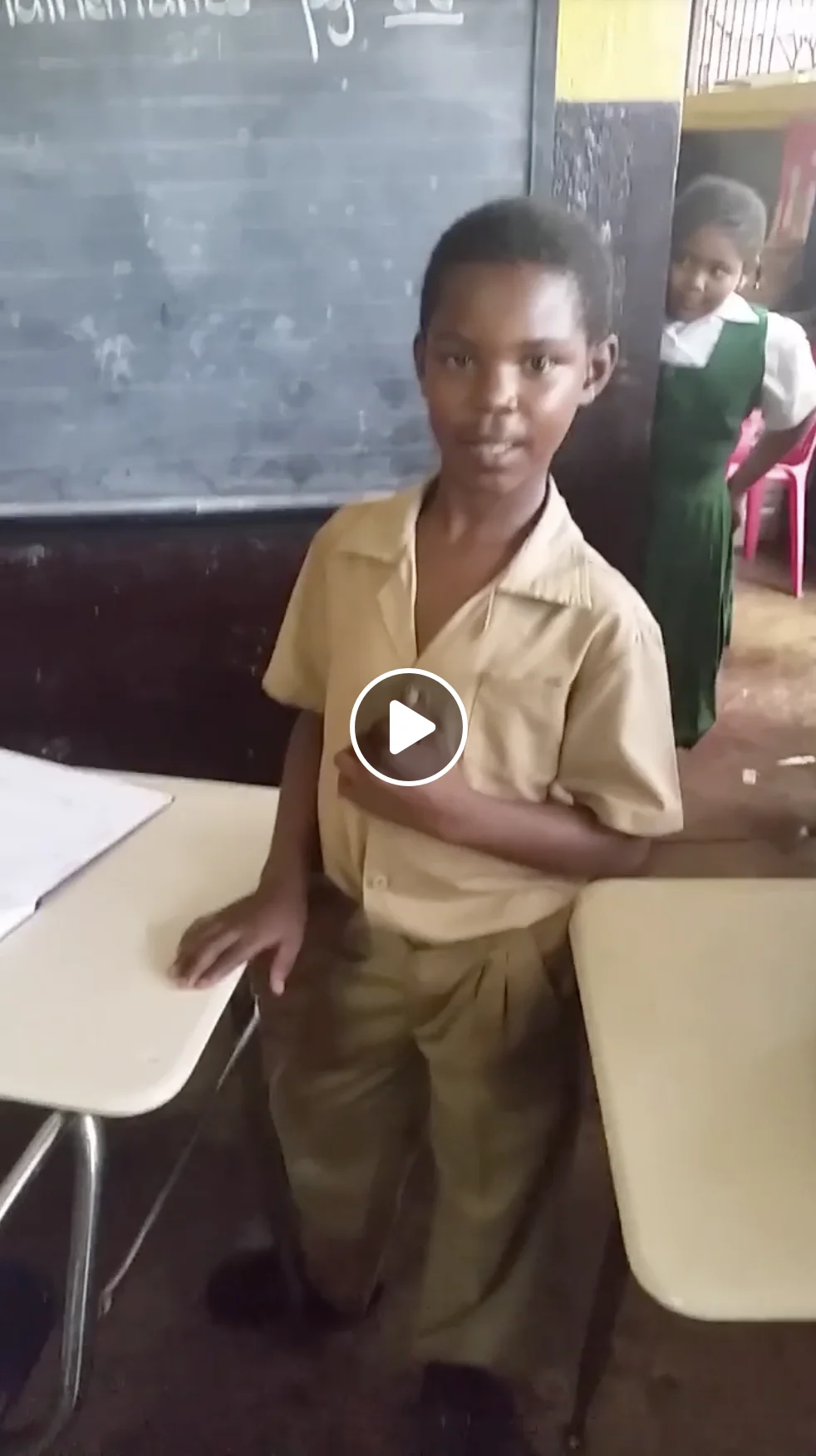 It's A Beautiful Day (TikTok Song) — Young Jamaican schoolboy Rushawn Jenkins in tan school uniform standing in a classroom with chalkboard behind him
