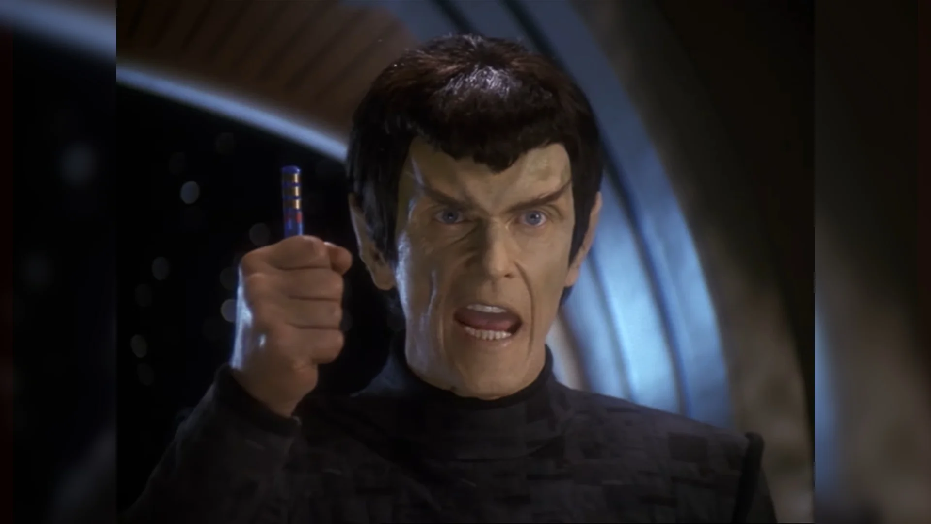 It's a Fake! — Angry Romulan from Star Trek holding up a small blue cylinder and shouting