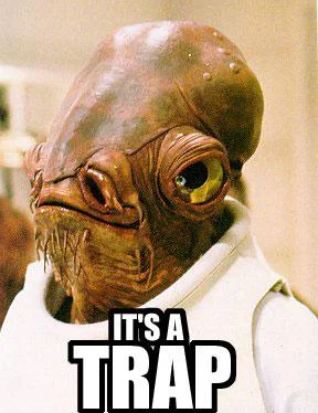 Tight close-up of Admiral Ackbar's face with bold white Impact font 'IT'S A TRAP' text.