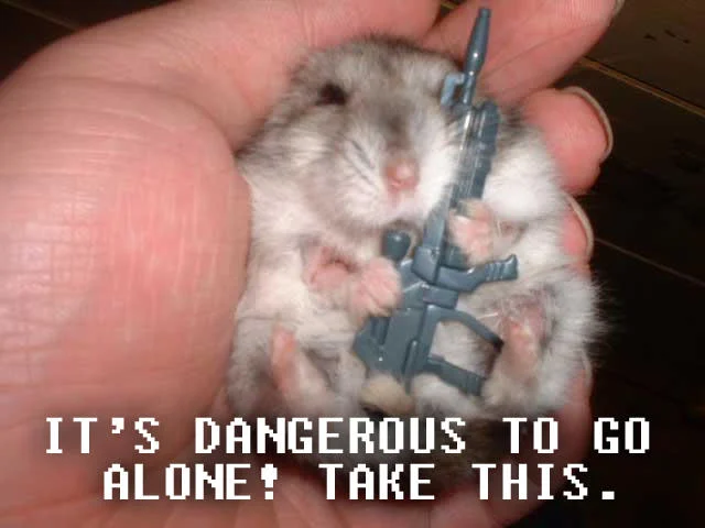 It's Dangerous to Go Alone! Take This — Printed flyer with pixel sword pull-tabs saying 'It's dangerous to go alone! Take one of these!'