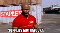 James Doakes Surprise Motherfucker — James Doakes photoshopped wearing a red Staples employee shirt with text 'SUPPLIES MUTHAFUCKA' at the bottom.