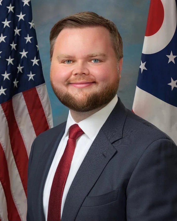 J.D. Vance Babyface Edits — Babyfaced JD Vance edit of his official Senate portrait in front of American and Ohio flags.