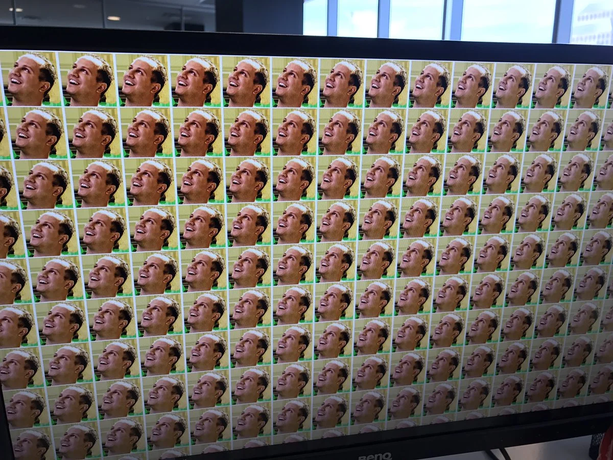 Tweet from Alex Jebailey showing a computer wallpaper made from tiled Jebaited emote faces