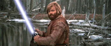 Jeremiah Johnson Nod Of Approval — Still frame from Jeremiah Johnson edited to include a lightsaber with forest and water background.