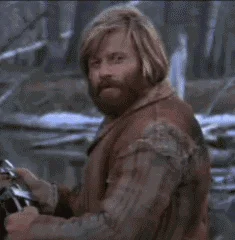 Jeremiah Johnson Nod Of Approval — Robert Redford as Jeremiah Johnson in the iconic nod-of-approval pose looking back over his shoulder in 1970s wilderness