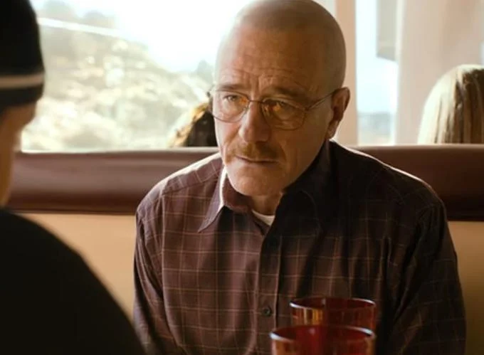 Jesse What Are You Talking About — A single scene of Walter White with a stern, serious expression from Breaking Bad or El Camino.