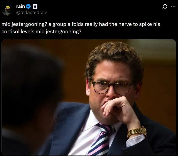 Tweet questioning whether a group had the audacity to spike Clavicular's cortisol levels mid jestergooning with a contemplative businessman photo.