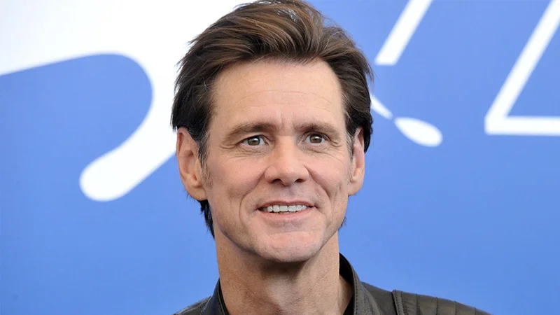 Close-up portrait of Jim Carrey smiling at a press event