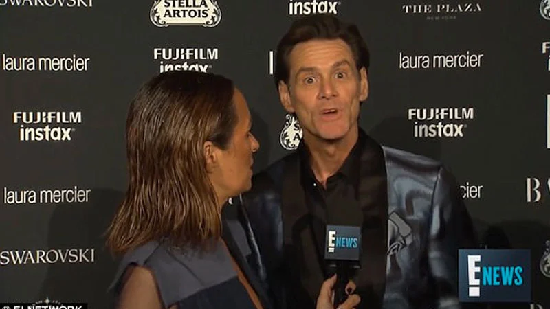 Jim Carrey's "We're Nothing" Rant — Jim Carrey speaking wide-eyed to an E! News reporter on a red carpet with sponsor logos behind him