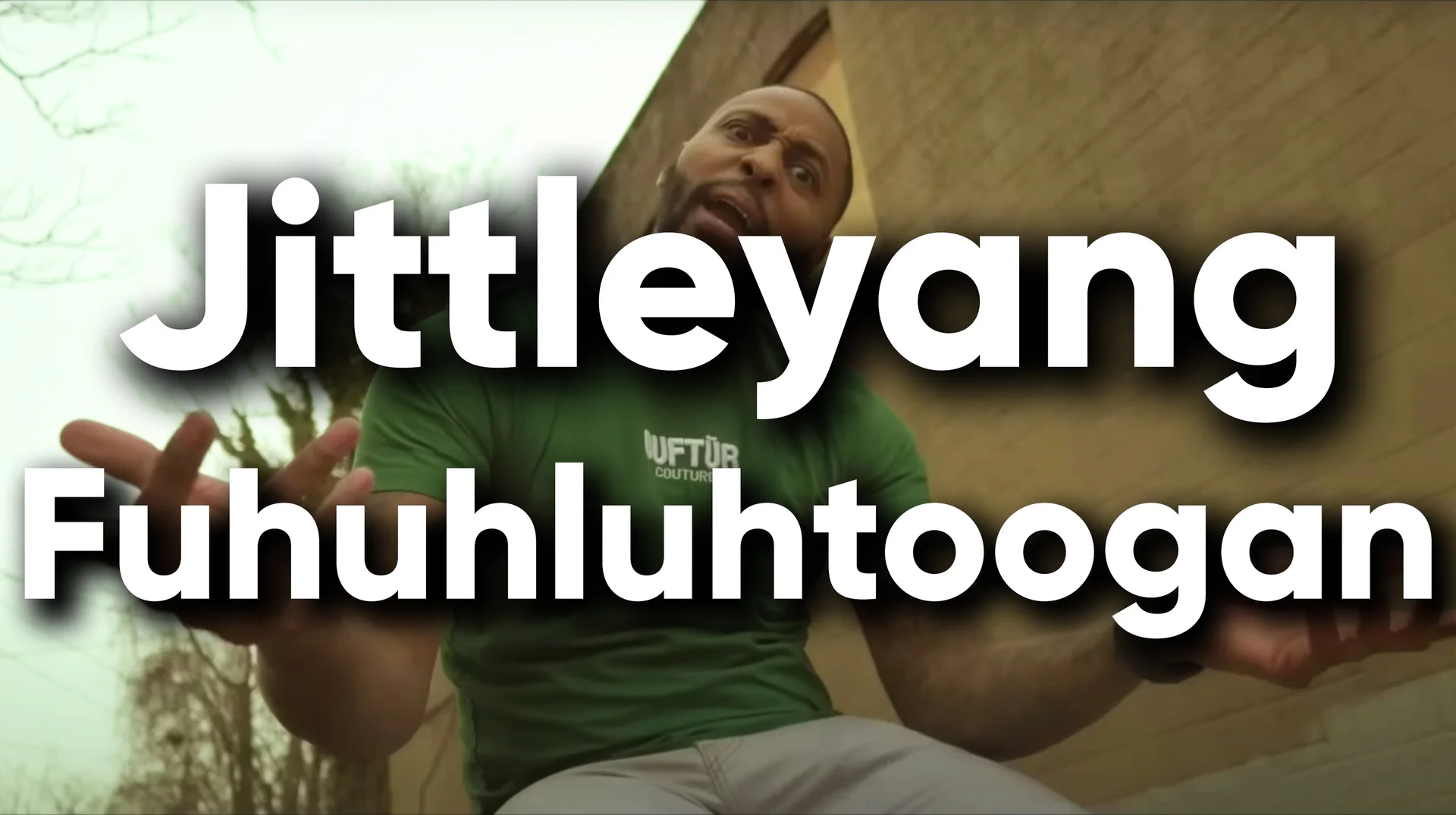 Man in green shirt gesturing outdoors with 'Jittleyang Fuhuhluhtoogan' text overlay