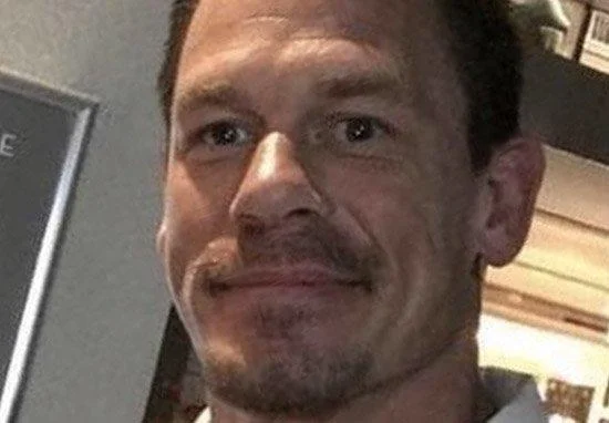John Cena Prank Call — A close-up headshot of John Cena with a subtle serious or contemplative expression.
