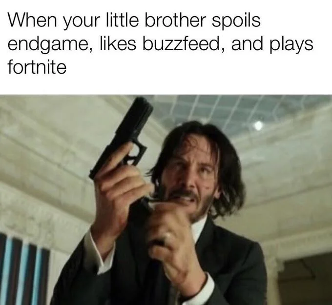 People taunting a dog above a blurred John Wick reloading his pistol