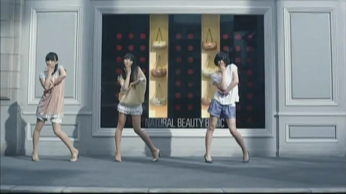 Jojos Pose — Three young women perform dramatic angular JoJo Dachi poses in front of a Natural Beauty Basic clothing store.