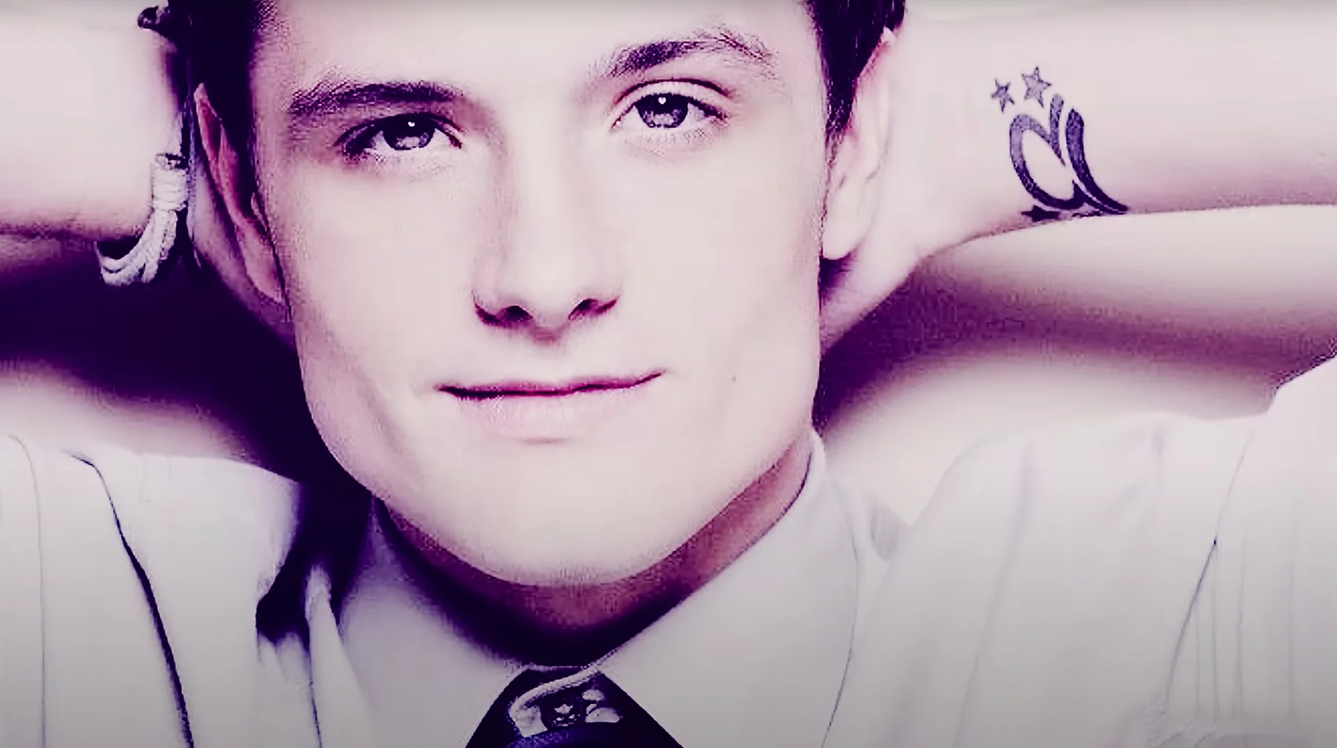 Josh Hutcherson Whistle Edit — Close-up stylized portrait of Josh Hutcherson smiling with hands behind his head, from the viral whistle edit