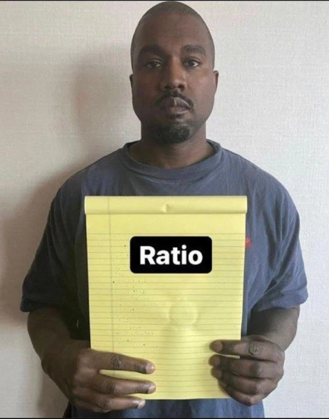 Kanye West holding notepad with 'Ratio' displayed in bold white text on black rectangle overlay.