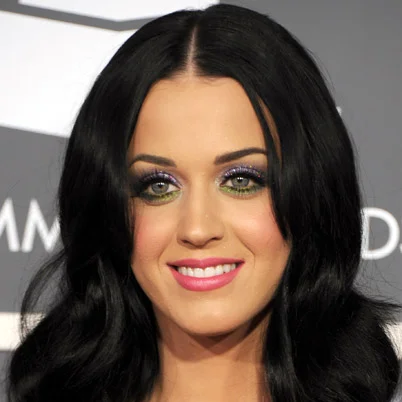 Katy Perry portrait with dark hair and pink lipstick at Grammy Awards red carpet