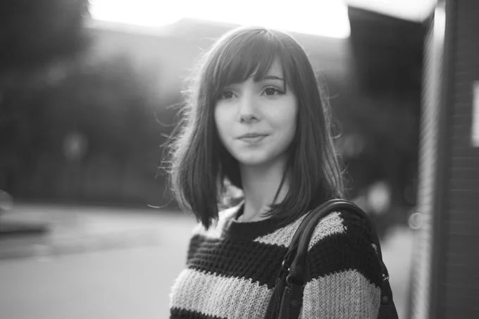 Black and white portrait of Katya Lischina in striped sweater